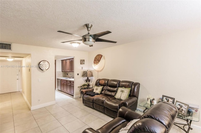 tiled living room featuring ceiling fan