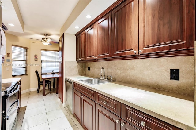 kitchen featuring sink, ceiling fan, light tile patterned floors, tasteful backsplash, and stainless steel appliances