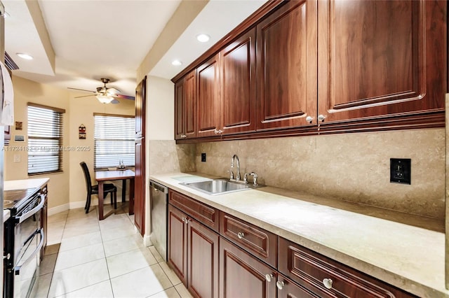 kitchen featuring a sink, light countertops, appliances with stainless steel finishes, decorative backsplash, and light tile patterned flooring