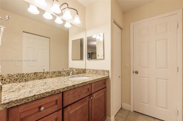 bathroom featuring tile patterned floors and vanity