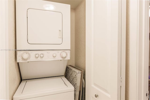 laundry room featuring stacked washing maching and dryer