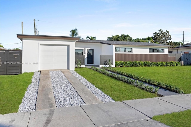 single story home featuring a front yard and a garage