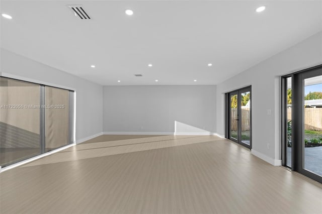 empty room with light wood-type flooring