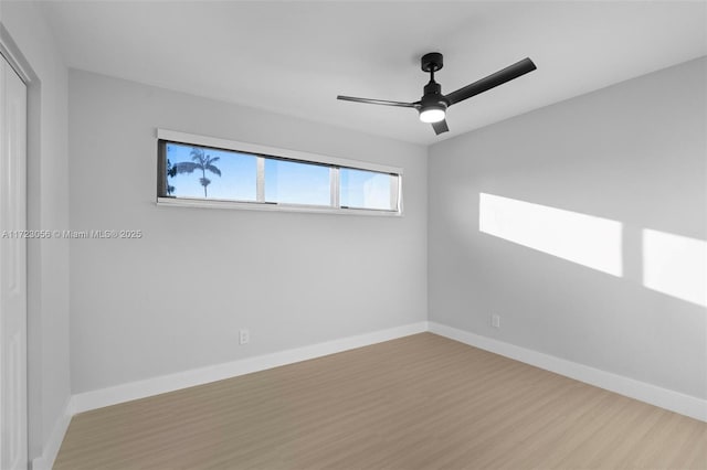 empty room featuring ceiling fan and light hardwood / wood-style flooring