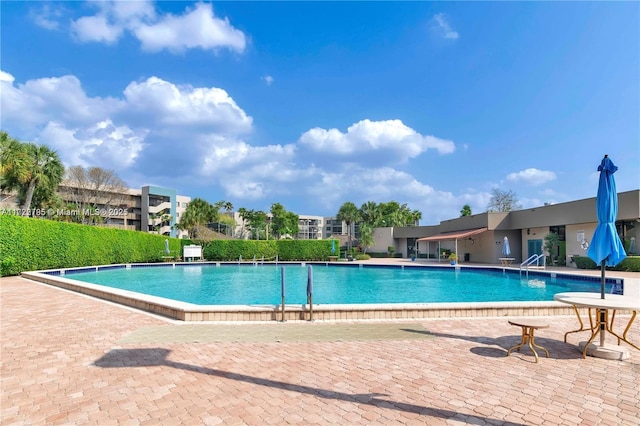 view of swimming pool featuring a patio