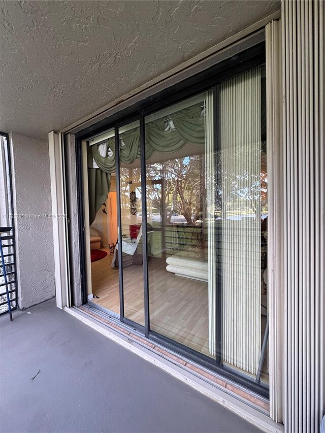 entrance to property featuring a balcony