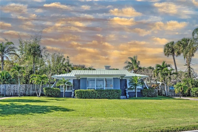 ranch-style house with a lawn