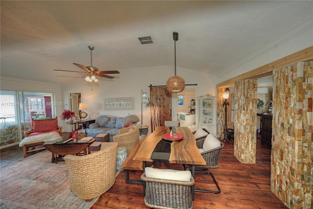 dining area featuring lofted ceiling, ceiling fan, dark hardwood / wood-style floors, and crown molding