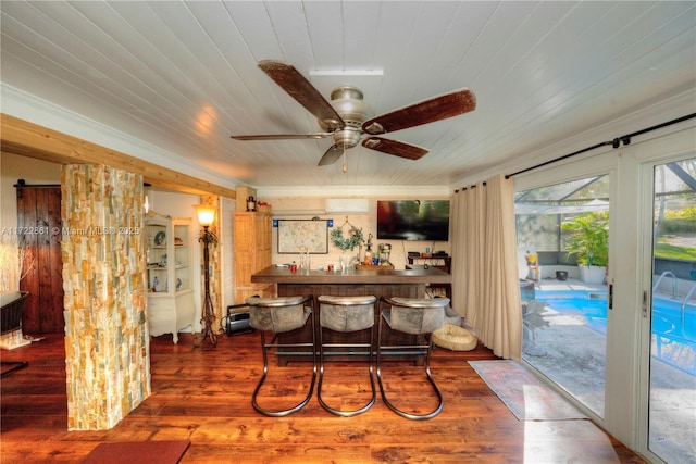 bar with ceiling fan, hardwood / wood-style flooring, and wooden ceiling