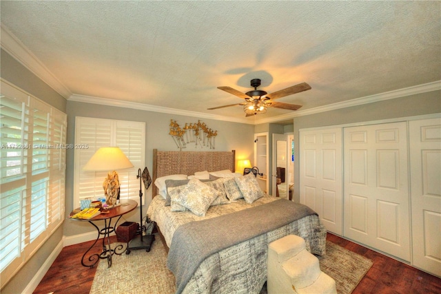 bedroom featuring ceiling fan, dark hardwood / wood-style floors, and ornamental molding