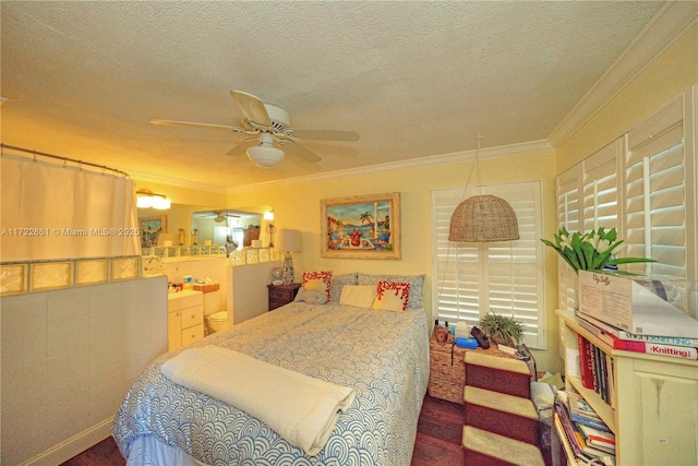 bedroom featuring a textured ceiling, ceiling fan, and ornamental molding