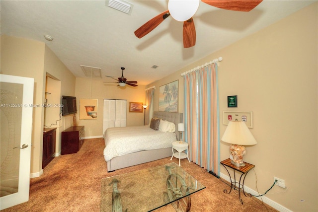 bedroom with ceiling fan, carpet, and a closet