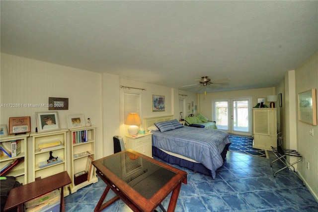 bedroom with a textured ceiling and ceiling fan