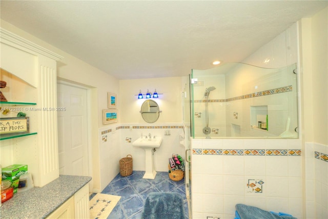 bathroom featuring walk in shower and tile walls