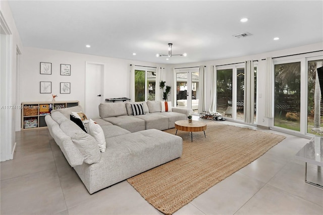 living room with a notable chandelier