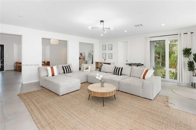 living room with a notable chandelier