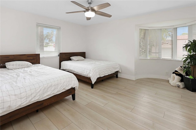 bedroom featuring ceiling fan and light hardwood / wood-style flooring