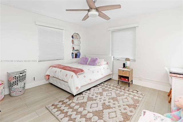 bedroom with hardwood / wood-style flooring and ceiling fan