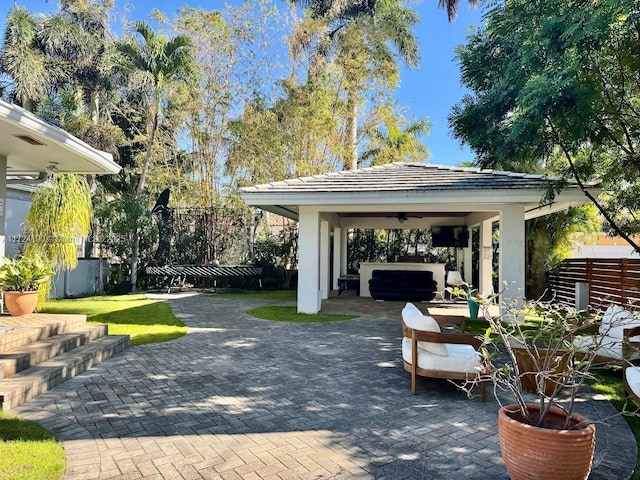 view of patio with a hot tub and a gazebo