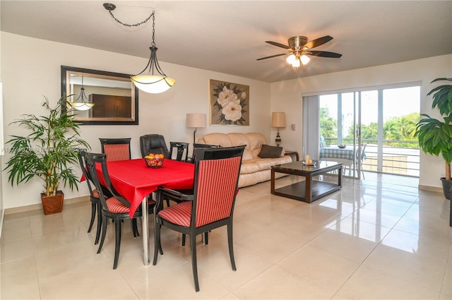 dining space with ceiling fan and light tile patterned flooring