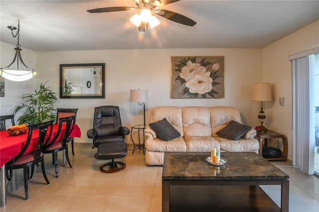 tiled living room featuring ceiling fan