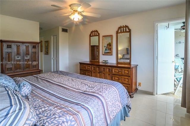 bedroom featuring light tile patterned floors and ceiling fan