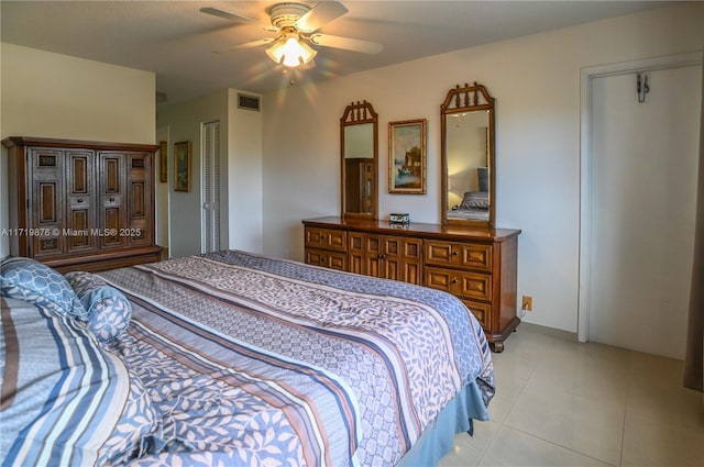 tiled bedroom with ceiling fan