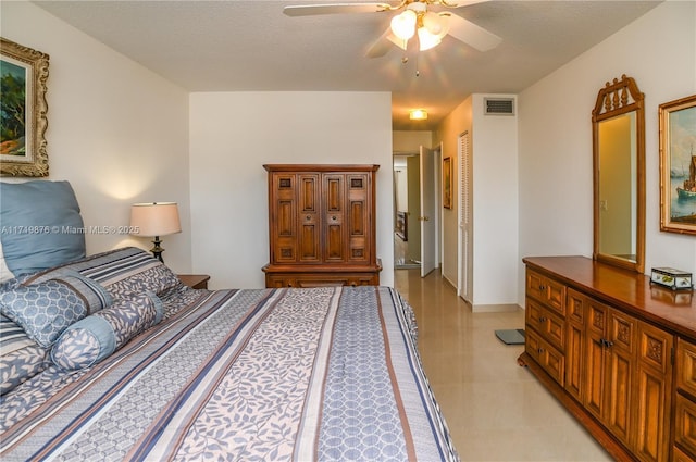 bedroom with a textured ceiling, a closet, and ceiling fan