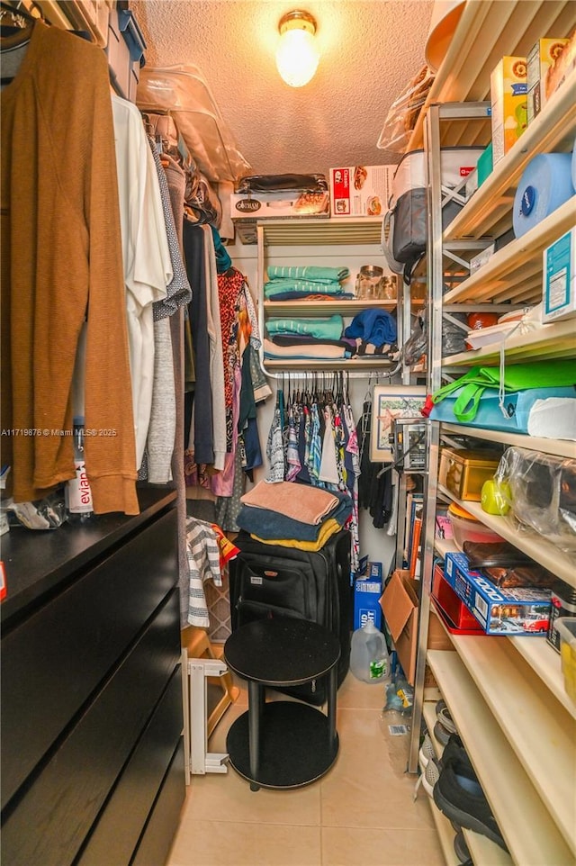 walk in closet featuring light tile patterned floors