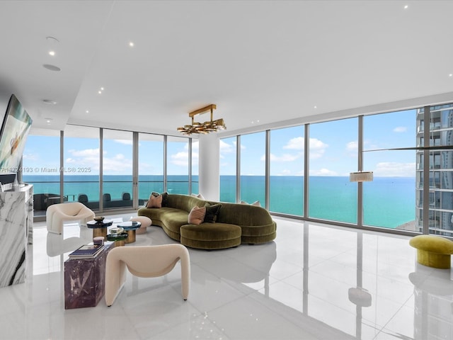 living room featuring light tile patterned flooring, plenty of natural light, and expansive windows