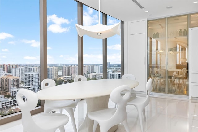 tiled dining area with a wall of windows and plenty of natural light