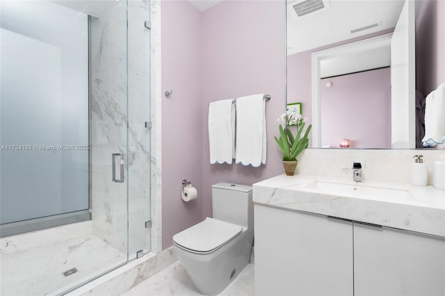 bathroom with a shower with shower door, vanity, and toilet