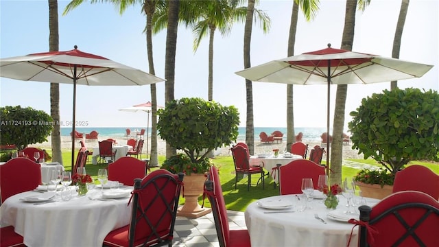 view of patio with a water view