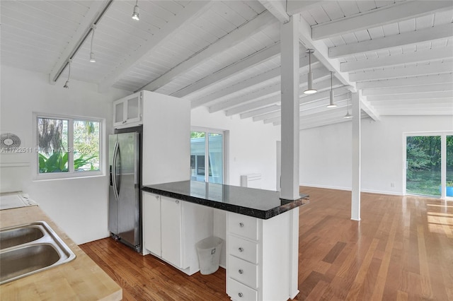 kitchen with dark hardwood / wood-style floors, sink, white cabinetry, and stainless steel refrigerator with ice dispenser