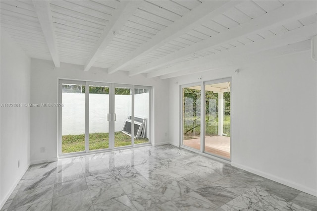 spare room with beam ceiling, a water view, and wood ceiling