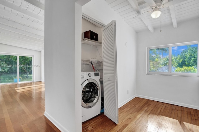 laundry room with ceiling fan, hardwood / wood-style floors, wood ceiling, and washer / dryer