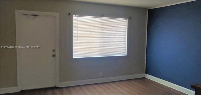 unfurnished room featuring hardwood / wood-style flooring