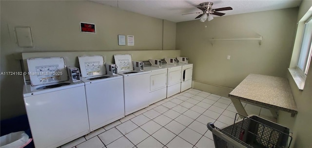 laundry area featuring washer and dryer, ceiling fan, and light tile patterned floors