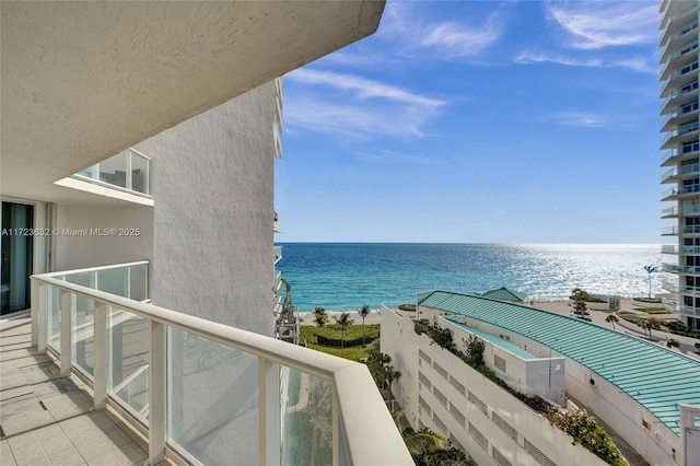 balcony featuring a water view