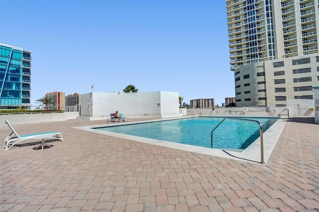 view of swimming pool with a patio