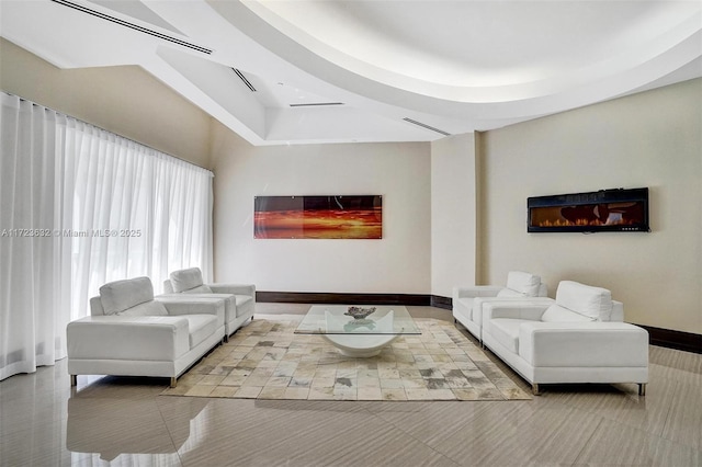 living room featuring a tray ceiling