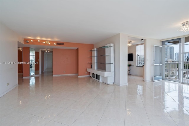 tiled empty room with floor to ceiling windows