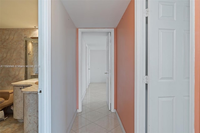 hallway featuring light tile patterned flooring