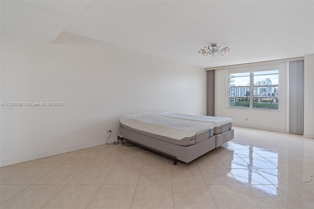 bedroom featuring light tile patterned floors