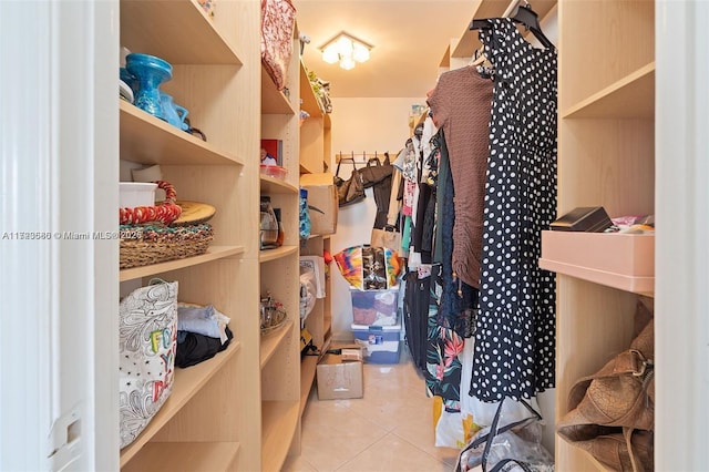 spacious closet with light tile patterned flooring