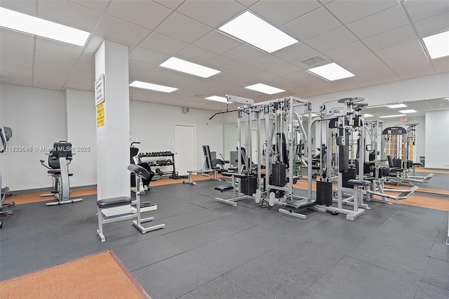 exercise room featuring a drop ceiling