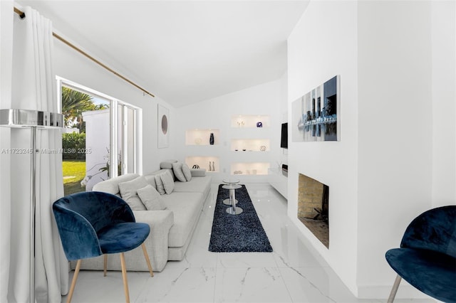 living room featuring vaulted ceiling