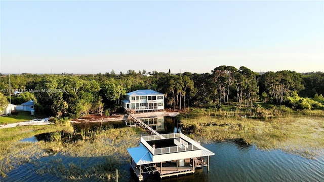 view of dock with boat lift and a water view