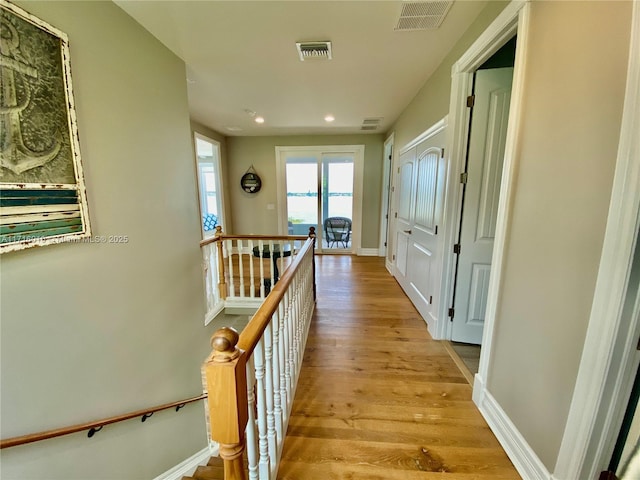 424 Lake Mirror Dr, Lake Placid, FL 33852 - hallway featuring an upstairs landing, light wood-type flooring, recessed lighting, and baseboards