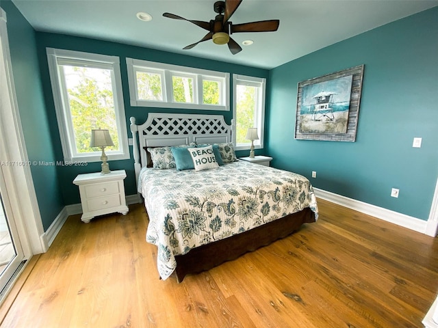 424 Lake Mirror Dr, Lake Placid, FL 33852 - bedroom featuring baseboards, wood finished floors, multiple windows, ceiling fan, and recessed lighting